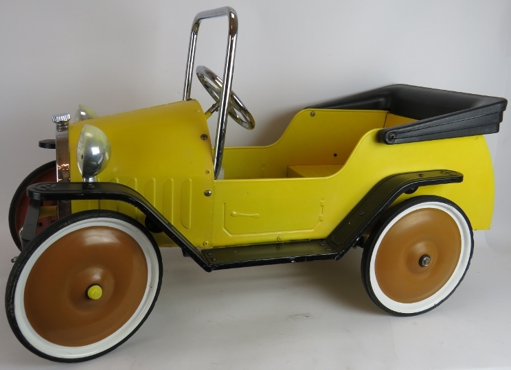 A vintage style child's pedal car of steel construction with working steering. Length 96cm.