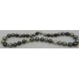 An AAAA quality 'peacock' Tahitian Southsea pearl necklace with radiant lustre and set with 8