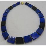 An unusual probably Greek lapis lazuli & onyx fan shaped 'collarette' necklace with 14ct yellow gold