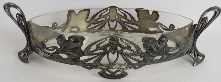 An Art Nouveau glass lined pewter fruit bowl of elliptical form by Max Hacger, Austrian, marked to