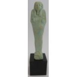 An ancient Egyptian faience ushabti decorated in light blue glaze, believed to be c1070-945 BC.