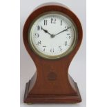 A small Edwardian baloon shaped mantle clock with inlaid walnut case and French movement. No key.