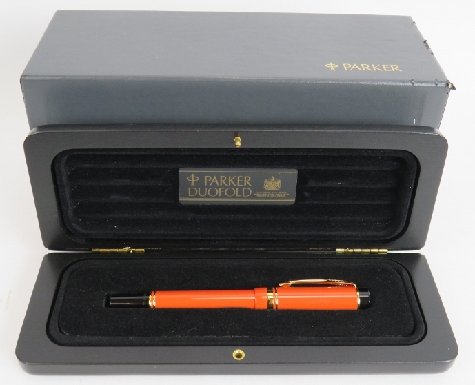 A 1980s Parker Duo Fold International fountain pen, brand new old stock. Orange body, 18ct gold nib,