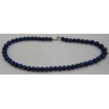 Lapis Lazuli necklace of even size beads, 18" length. Condition report: Excellent condition.