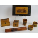 A small collection of Mauchline ware including trinket boxes, napkin rings, beaker and pen holder,