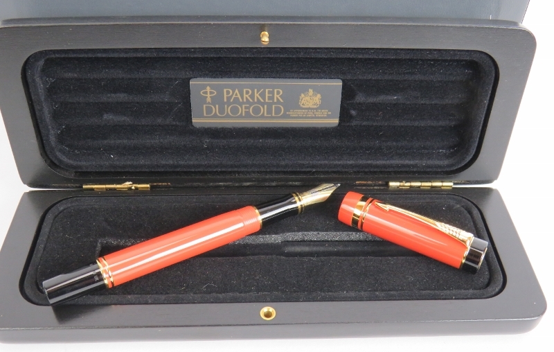 A 1980s Parker Duo Fold International fountain pen, brand new old stock. Orange body, 18ct gold nib, - Image 2 of 5