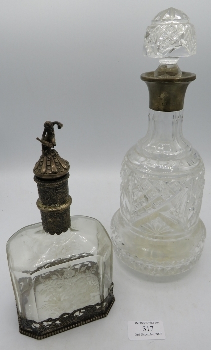 A finely engraved glass liqueur bottle with silver mounts. Import marks for London 1895 with