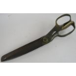 A large pair of 19th century tailor's shears by Thomas Wilkinson, Sheffield. Brass handles, steel