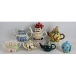 Seven mixed novelty teapots including Desperate Dan, squirrels, teddy bears and a royal