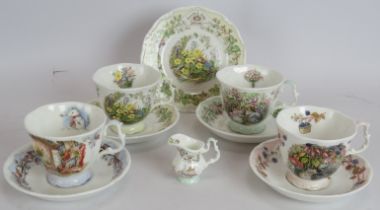 A Royal Doulton Brambly Hedge four seasons part tea set consisting four cups and saucers, one