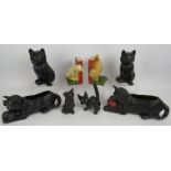 Five antique Bretby pottery cats, a similar dog and a pair of Bretby bookends. Largest 26cm x