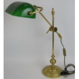 A vintage style brass cantilever banker's lamp with green glass shade. Overall height 60cm (