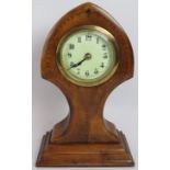 A walnut cased Art Nouveau mantel clock with delicate foliate inlay. No key. Height 31cm.