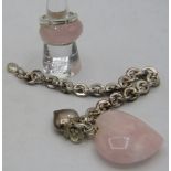 A heavy white metal link bracelet with heart shaped charm & flower and a heavy heart shaped rose