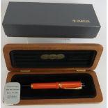 A 1980s Parker Duo Fold Centennial fountain pen, brand new old stock, orange body, 18ct gold nib,