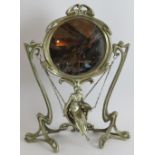 A reproduction Art Nouveau style dressing mirror with pivoting circular mirror over a lady on a
