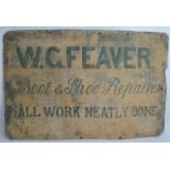 A hand sign-written tin sign for W.G. Feaver, Boot and Shoe Repairs with 'Ghost' sign of a factory