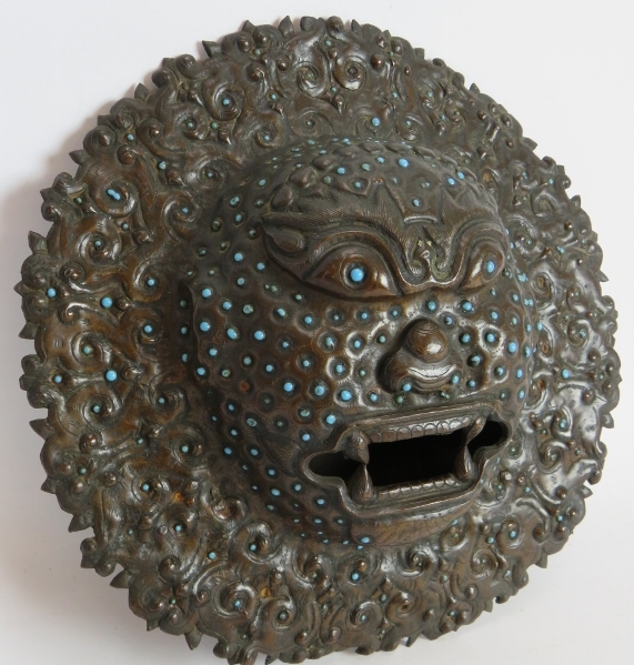 An antique bronze Indian temple mask inset with small blue stones. Believed to be used for warding - Image 2 of 3