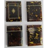 Four 19th century cushion shaped tortoiseshell card cases, one with white metal cartouche and
