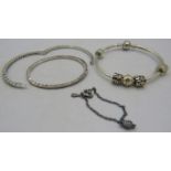 A Pandora bangle with 3 charms & ball clasp, boxed, two hinged Pandora pave bracelets, marked