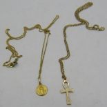 An 18ct yellow gold religious medallion on a fine 18ct yellow gold chain, a 9ct yellow gold Ankh