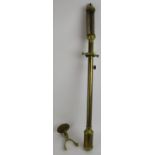 A brass ships barometer with gimball wall mount, signed Rosetti London 1892. Length 92cm.