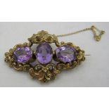 A fine 19th century yellow metal brooch set with 3 large oval amethysts. Each amethyst approx 18mm x