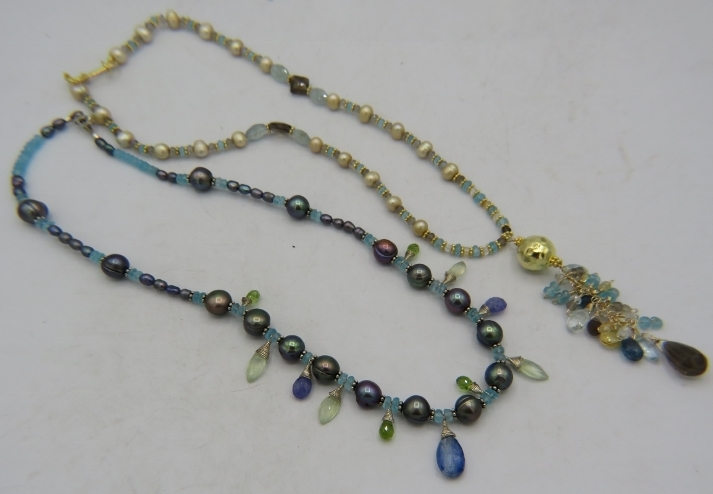 A gold vermeil necklace with blue pearls, centre sapphire, aquamarine & apatite and a gold vermeil