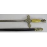 A vintage Knights of Columbus ceremonial sword with figural hilt, etched blade and wooden handle