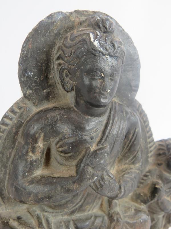 An antique Indo-Greek carved hardstone figure of a seated Buddha with a praying attendant. Indian - Image 2 of 3