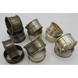 A collection of 12 silver napkin rings, all fully hallmarked. Including a plain pair, Birmingham