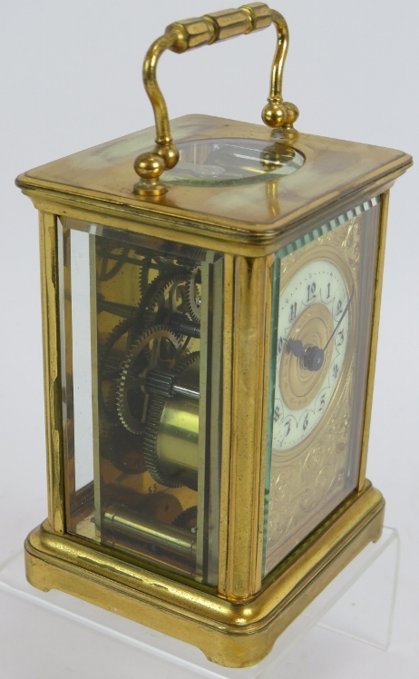 A 19th century gilt brass cased carriage clock with engraved gilt mask and enamelled dial ting. - Image 2 of 8