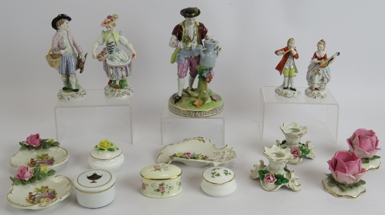 A collection of Dresden and other porcelain including two pairs of figures, a single figure, two