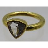 An 18ct yellow gold exceptionally rare phenakite trillion cut ring, having amazing sparkle, size