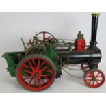 A live steam 1 1/2" scale model of a Burrell steam tractor traction engine. Length 61cm. Height