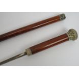 A Victorian malacca cane sword stick with hallmarked silver collar, Birmingham, 1895. Square profile