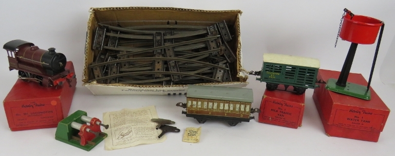 A vintage clockwork Hornby 0 Gauge No 501 locomotive, a No 1 milk traffic van, an LNER carriage,