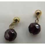 A pair of possibly French yellow metal garnet drop earrings. Backs marked 14ct and posts with