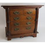 A small set of antique oak drawers/collectors cabinet. Possibly an apprentice piece. Height 38cm.