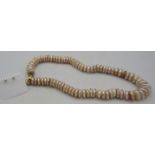 A pink button pearl necklace with heavy 18ct yellow gold lobster clasp, approx 18" long and a pair