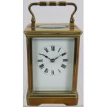 An early 20th century brass cased striking carriage clock stamped Made in France, No 18265. Case