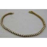 An 18ct yellow gold tennis bracelet set with 60 diamonds, approx 2cts, approx weight 8.4 grams,