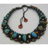 A fine worked Tibetan turquoise, pearl and mixed semi-precious stone necklace, boxed. Approx