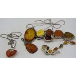 Four items of amber jewellery, all marked 925 to include a heart shaped pendant on a 925 stamped