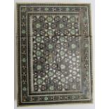 An antique Indo-Persian card case decorated with bone and metal micro-mosaics. 10cm x 7.5cm.