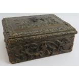 A heavily embossed leather antique workbox with contents including pin cushions, scent bottle,