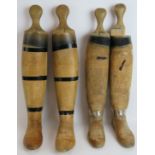 Two pairs of vintage beech wood riding boot trees, one male and one female. One tree bears a label