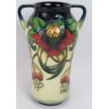 A two handled Moorcroft pottery vase in Anna Lily design, height 26.5cm. Condition report: No