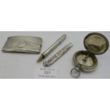 An 800 marked white metal cased compass, a Scottish curved silver card case, Edinburgh 1904, a