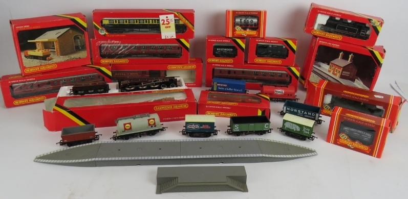 A large quantity of Hornby 00 gauge railway carriages, track, rolling stock, buildings,